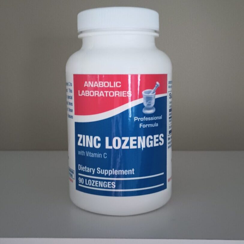 A bottle of zinc lozenges on top of a table.
